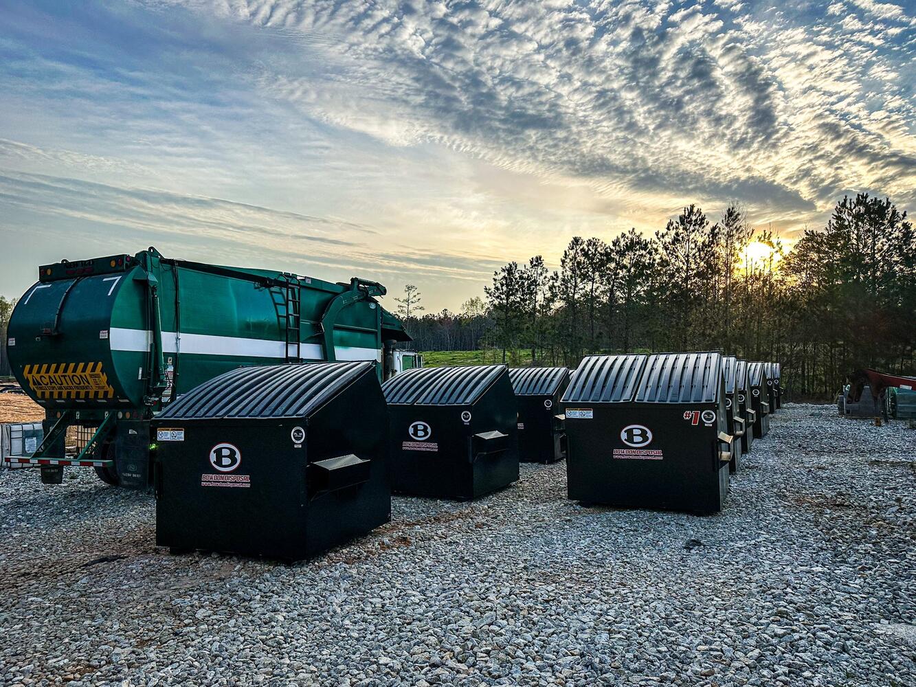 Bowdon Disposal Commercial Dumpsters in Yard